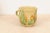 A French pottery mug from the 19th century, with yellow, green and rust glaze. Created in France during the 19th century,...