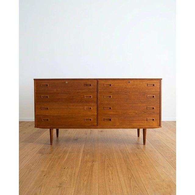 Vintage Danish teak chest of drawers from the 1950s with elegantly designed drawers, perfect for a functional and refined...