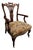 Victorian Carved Mahogany Armchair with Floral Upholstery and Brass Castors For Sale