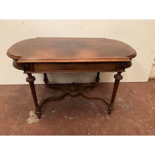 Napoleon iii rosewood and veneer writing desk four fluted legs with a stretcher between the legs one drawer in the apron...