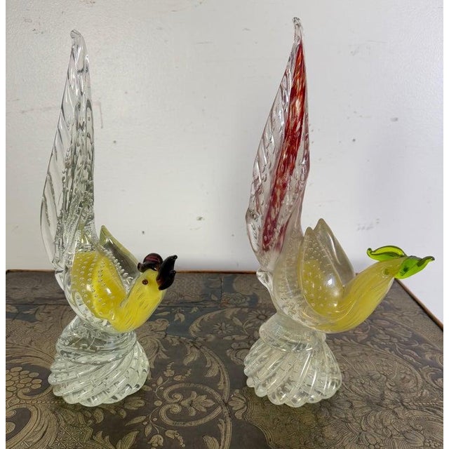 This is a pair of Murano glass rooster or pheasant figurines, crafted in the traditional Venetian glassblowing style....