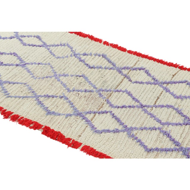 Hand-knotted in wool and originating from Morocco circa 1950-1960, this 3x6 vintage Moroccan rug is an extremely rare...