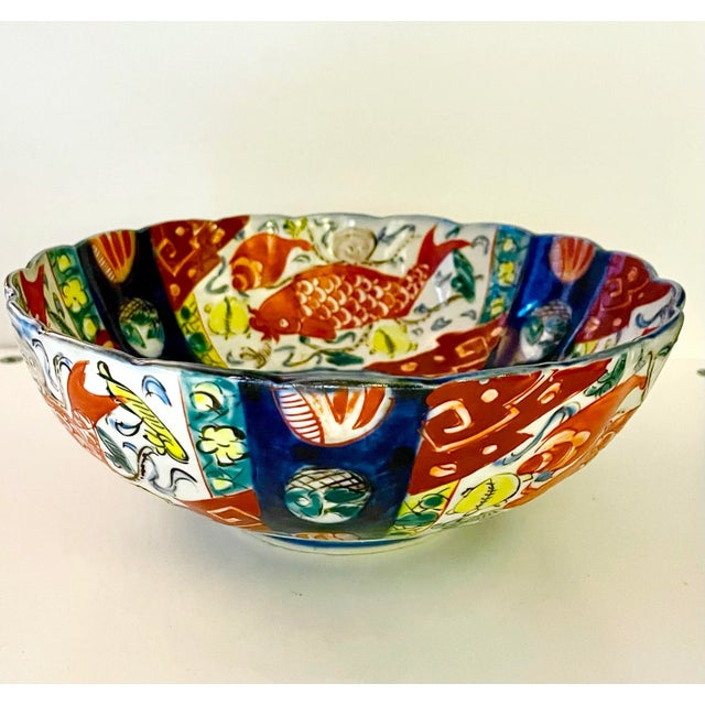 This bowl is a stunner. Rich imari colors yes. But the motif of koi plus octopus really make this bowl unique.