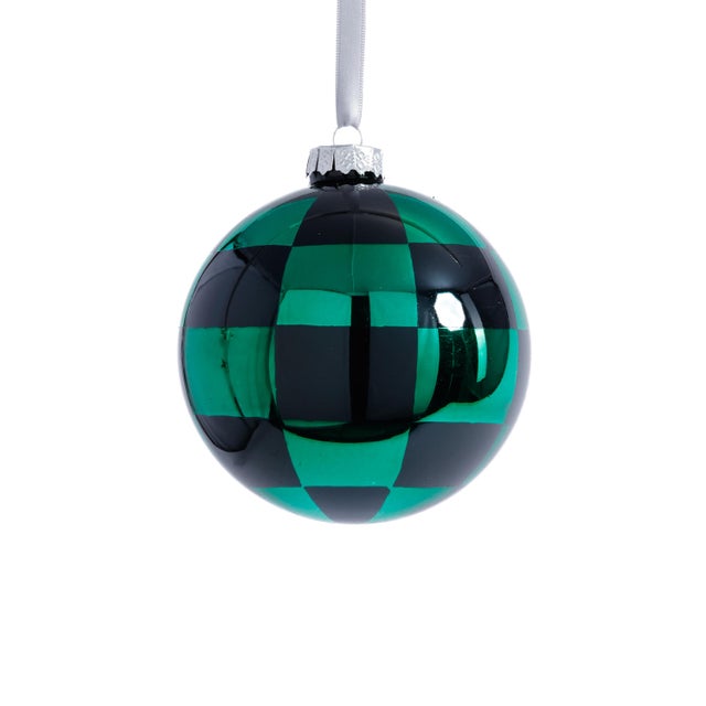 Add bold texture and modern flair to your holiday tree with this set of checkered glass ball ornaments. The eye-catching...