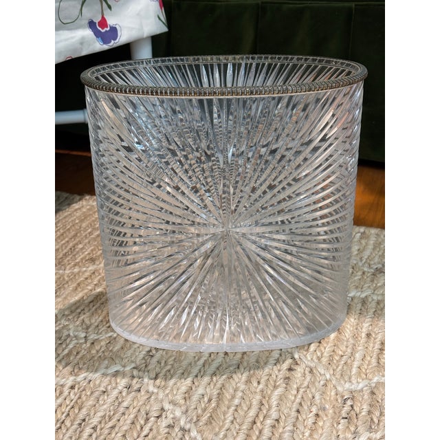 Vintage wastebasket that adds a whole lot of drama! Plastic with metal top edge. I have no knowledge of its date of...