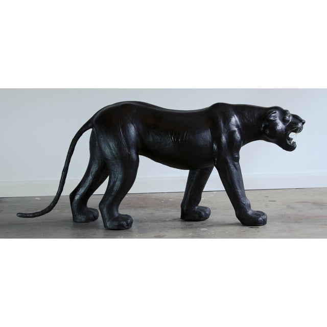 A commanding life-size black panther, hand-built over a sculpted armature and wrapped in what is believed to be leather,...