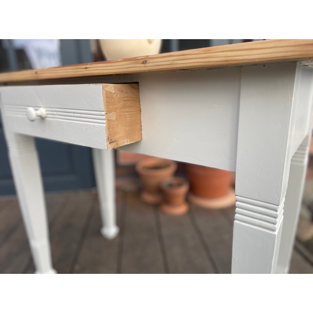 This charming antique table has been given a fresh coat of paint, sanded, and oiled. Width: 91.5 cm Depth: 49.5 cm Height:...