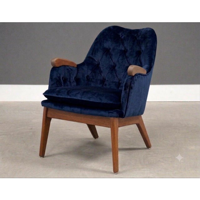 A mid century modern blue velvet petite lounge chair made with a solid walnut frame by Adrian Pearsall for Craft...