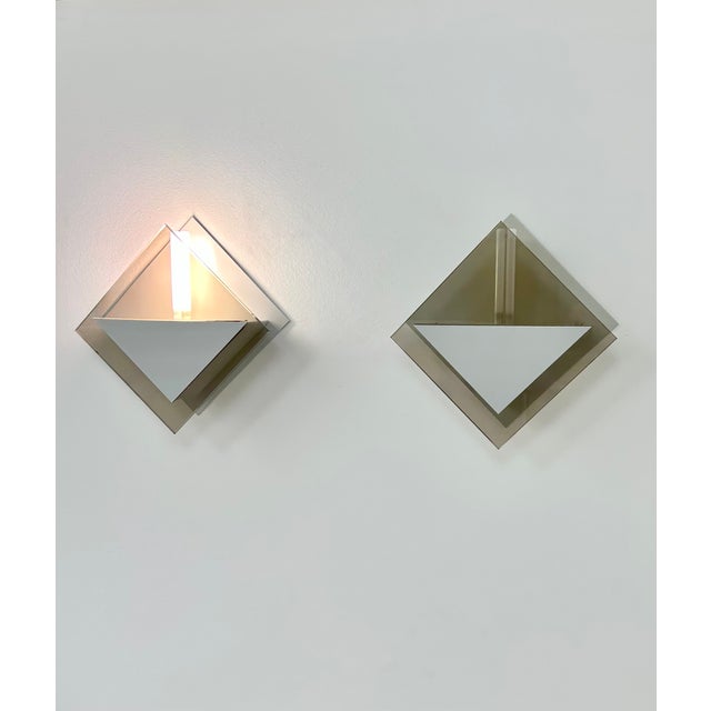 Pair of wall sconces produced by Verre Lumière Studio, model 20623, in France in 1980. Bronze Parsol glass and matte gray...