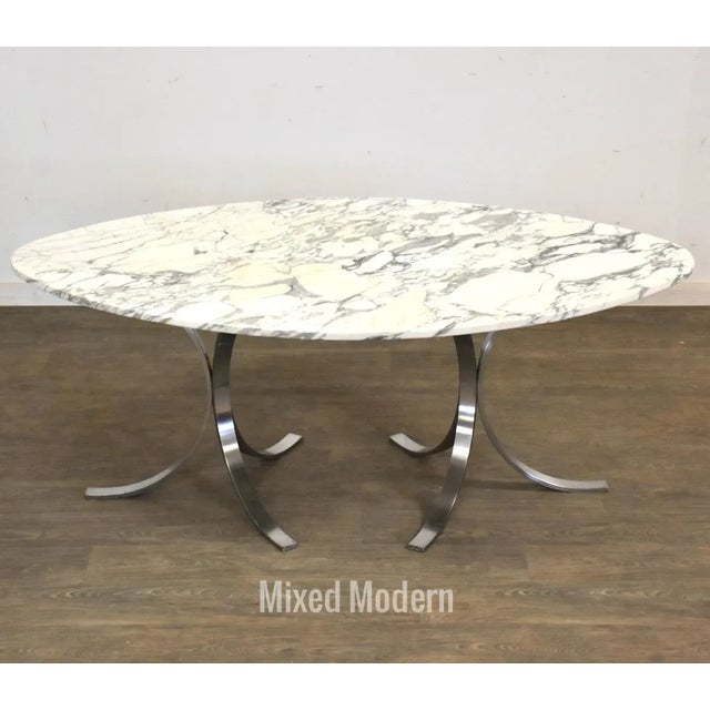 Offered is a fabulous vintage mid century modern solid steel base and Arabescato Corchia marble top dining table in the...