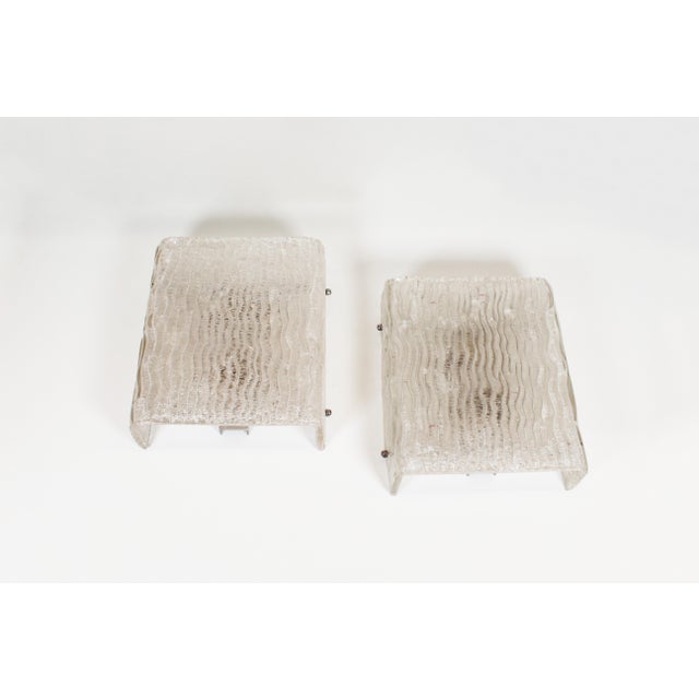 Large set of 'ice glass' wall lamps by Kaiser Leuchten. Both in perfect condition without damage. Frames have been...