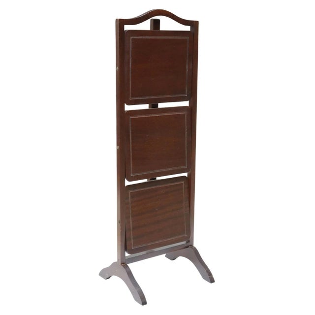 A charming English mahogany cake stand from the early 20th century. The signed Edwardian period antique having three...