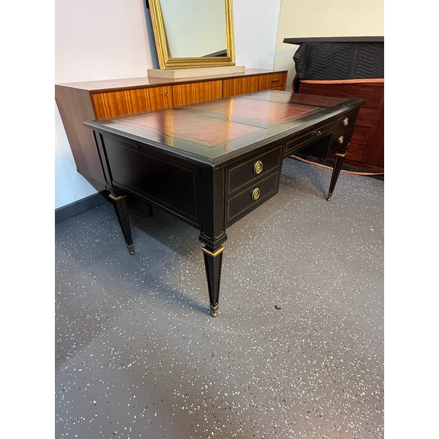 Elegant Lillian August for Hickory White library desk featuring an ebonized finish with gold trim and classic inset red...