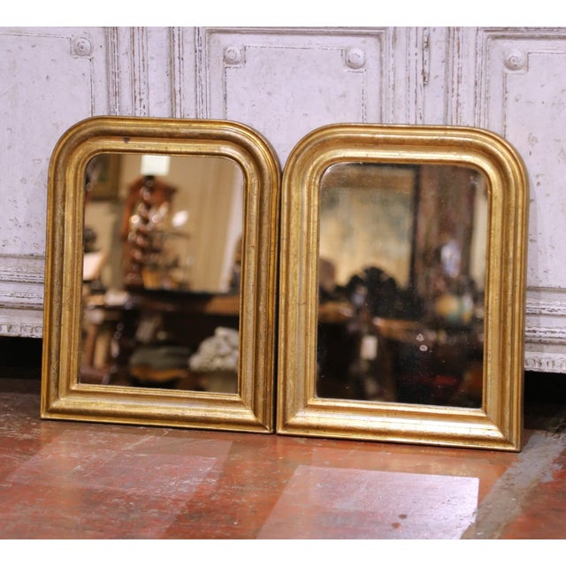 This elegant pair of antique French petite mirrors, crafted circa 1860, showcases the timeless simplicity and refined...