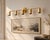 Bring a clean architectural presence to a bathroom, dressing area, or interior wall with this handcrafted brass 5-light...