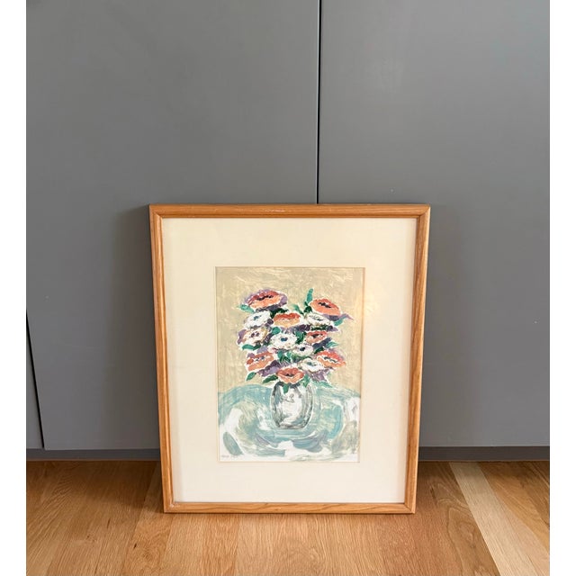 Vintage impressionist floral still life painting featuring a vase of flowers on a table using loose brushwork. Framed in a...