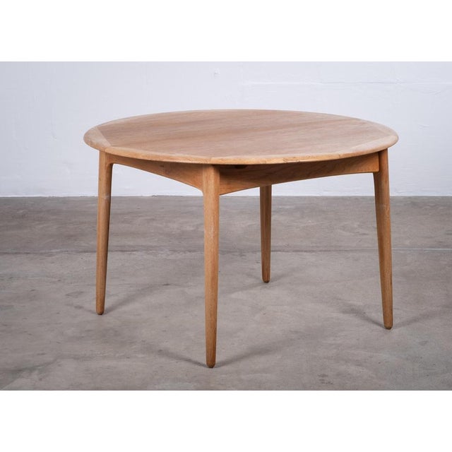 Elegant round dining table designed by renowned Danish designer Svend Aage Madsen and produced by K. Knudsen in the early...