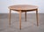 Elegant round dining table designed by renowned Danish designer Svend Aage Madsen and produced by K. Knudsen in the early...