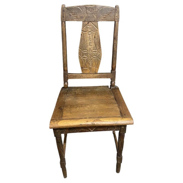 Antique hand carved teak chair from Sumatra with lovely angel wings and “ Take A seat " carved in the back rest. C 1950....