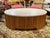 VINTAGE MID-CENTURY OVAL TRAVERTINE & PENCIL REED COFFEE TABLE -A chic and substantial vintage coffee table that...