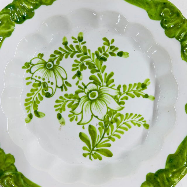 Hand painted decorative bowl in spring green floral pattern on a white background. Marked Meiselman, Italy. Measures 7"...