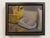 This oil on panel captures a quiet moment in a mop room, featuring a bright yellow mop bucket juxtaposed with a white...
