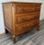 This Vintage French Louis style oak chest of drawers offers a timeless statement of craftsmanship and elegance....