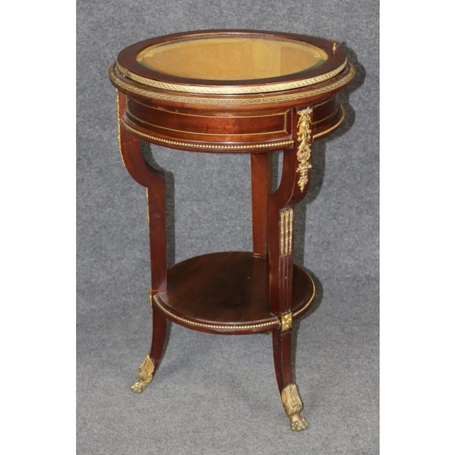 **French Louis XV Style Mahogany and Bronze Mounted Vitrine Table, Circa Early 20th Century** This exquisite **French...