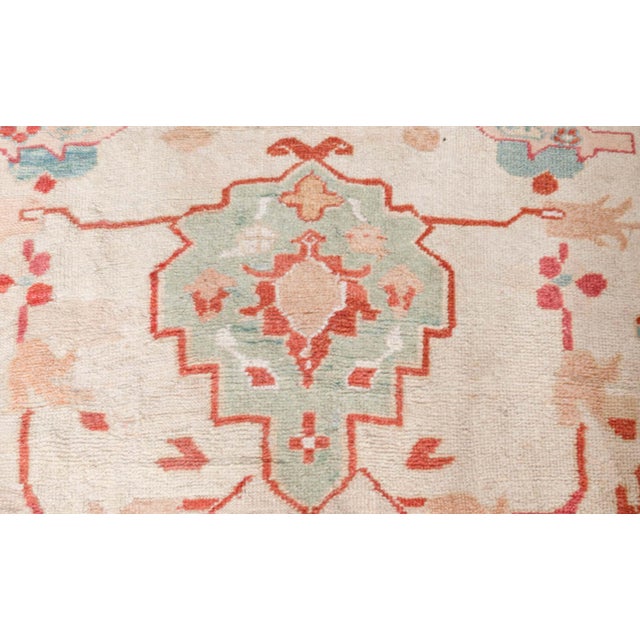 This antique, Sultanabad rug dates back to around 1920 and is hand-knotted out of wool. Its color palette features brown,...