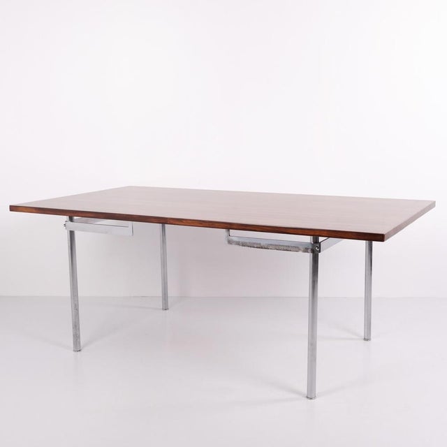 Hans J. Wegner dining table model AT 318 in rosewood with brushed steel frame. An rare early model made by Andreas Tuck,...