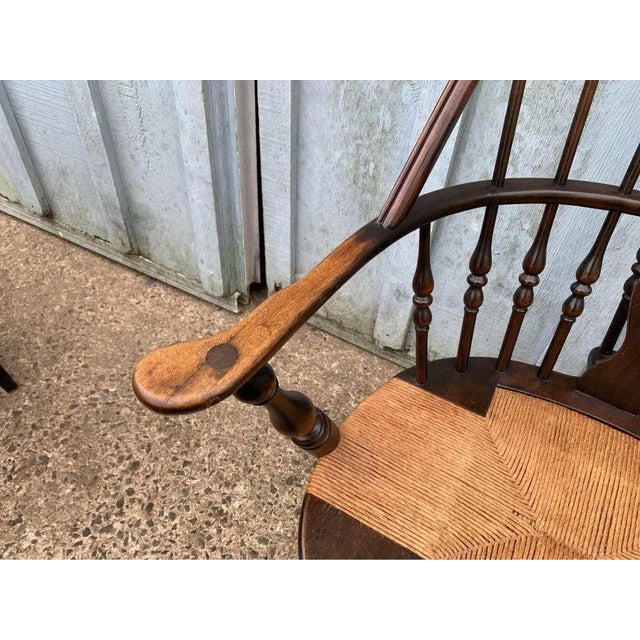 Antique Windsor Style Bowl Back Rush Seat Armchair. Solid wood frame, sturdy and comfortable Approximate measures: Height...