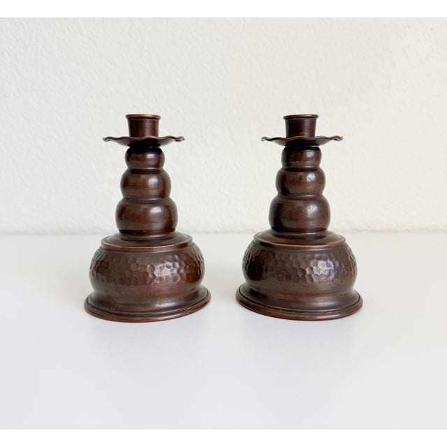 A wonderful pair of Scandinavian copper candle holders, highly characteristic of mid-century Scandinavian Modern design....