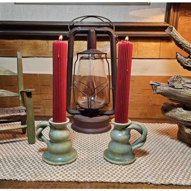 We are proud to offer a rare pair of Walter B. Stephen, "Twisted-handle", 4" Candlesticks in his famous Blue-green or Jade...