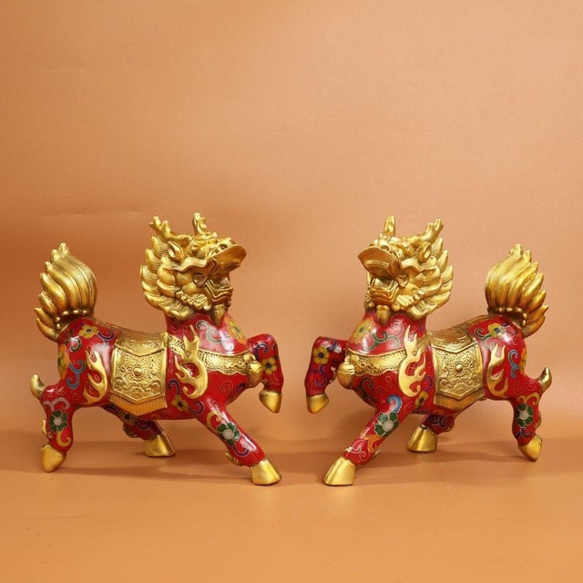 This is a matched pair of vibrant cloisonné enamel Qilin statues, mythical hooved creatures revered in traditional Asian...