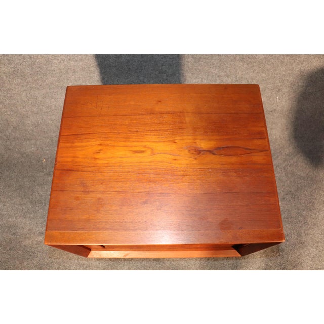 Pair of Mid-Century Modern end tables with tambour doors that recede behind the cabinet. Simple Danish design with storage...