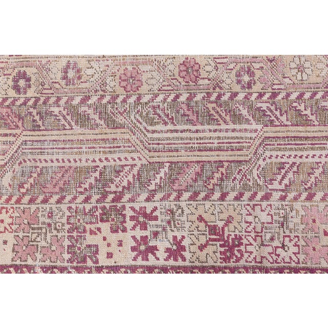 This exquisite Turkish Ghiordes rug from the 1880s showcases the masterful craftsmanship and rich cultural heritage of...