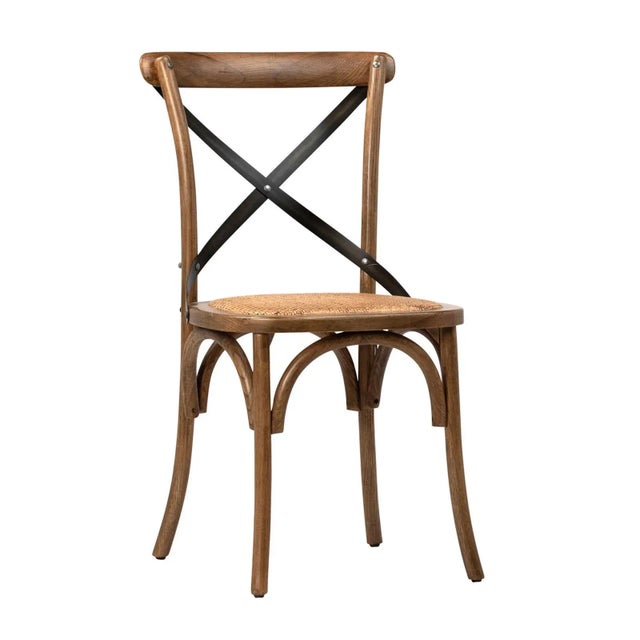 Sealed brown oak dining chair with woven rattan seat. Black metal X style back with iron rivets and thoughtful curved leg...