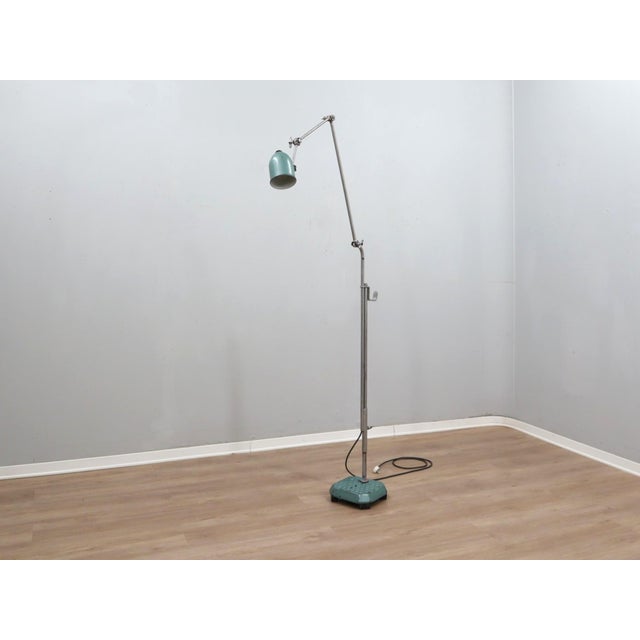 This extraordinary floor lamp is a masterclass in industrial reimagining, hand-assembled in the 1960s using high-quality...