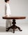 This round table makes its impression through dark burl walnut top, carved tripod pedestal base. Dating to 19th Century...