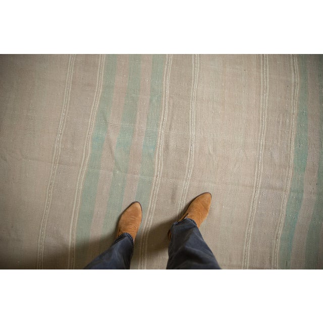 :: Horizontal bands in varying shades and thickness stretching across the width of the weave in soothing tone-on-tone and...