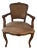 Vintage Petite Carved Wood Arm Chair With Cane Back and Suede Seat For Sale