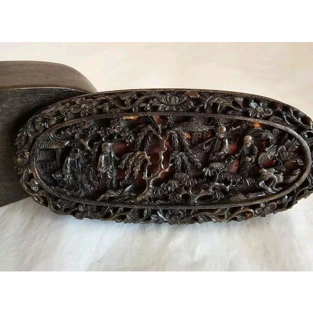 A finely crafted mid-19th-century Chinese Export Cantonese snuff box and cover, displaying the intricate decorative...