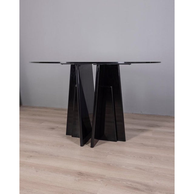 Round table with black lacquered wooden base and ground glass base, Italian design, 1980s.