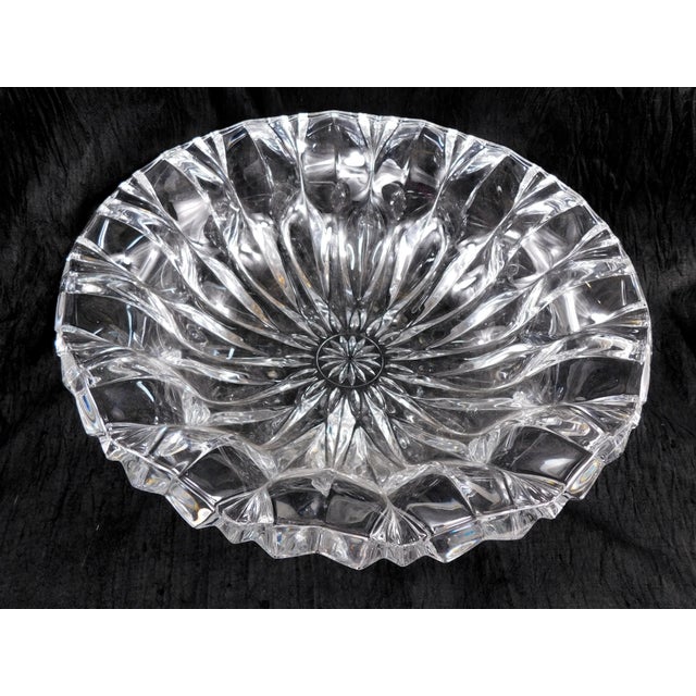 This is a beautiful large cut crystal bowl. I have not been able to find any kind of markings on it which seems odd as it...