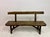 A pair of sculptural elm benches, showcasing a strong, organic approach to form and material. Each bench is crafted from...