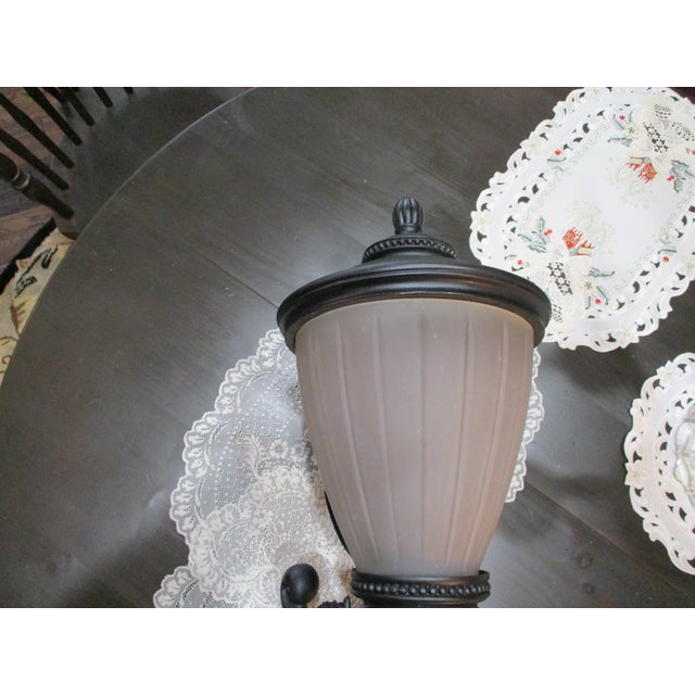 This vintage outdoor lamp features a unique glass shade, adding a touch of nostalgia to any outdoor space. The heavy...