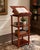 A handsome traditional adjustable lectern or music stand featuring a rich cherry-toned finish, fluted column supports, and...
