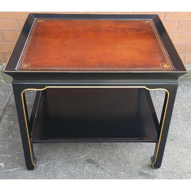 Heritage Henredon ming style Ebonized and Parcel Gilt Two Tier Side Table. Tooled Leather top. In great vintage condition....
