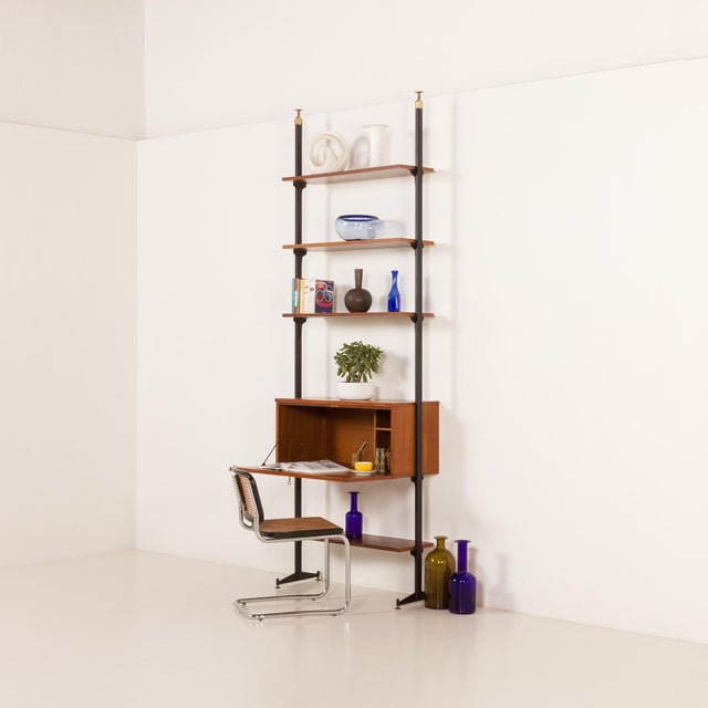 This italian mid century wall unit with a bureau was designed in the 1960s. It can be a perfect room divider for larger...