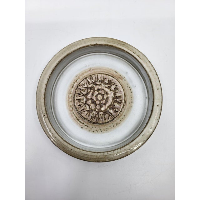 A superb stoneware trinket tray; the artist's identity remains unknown, but it strongly resembles the creations of Jacques...